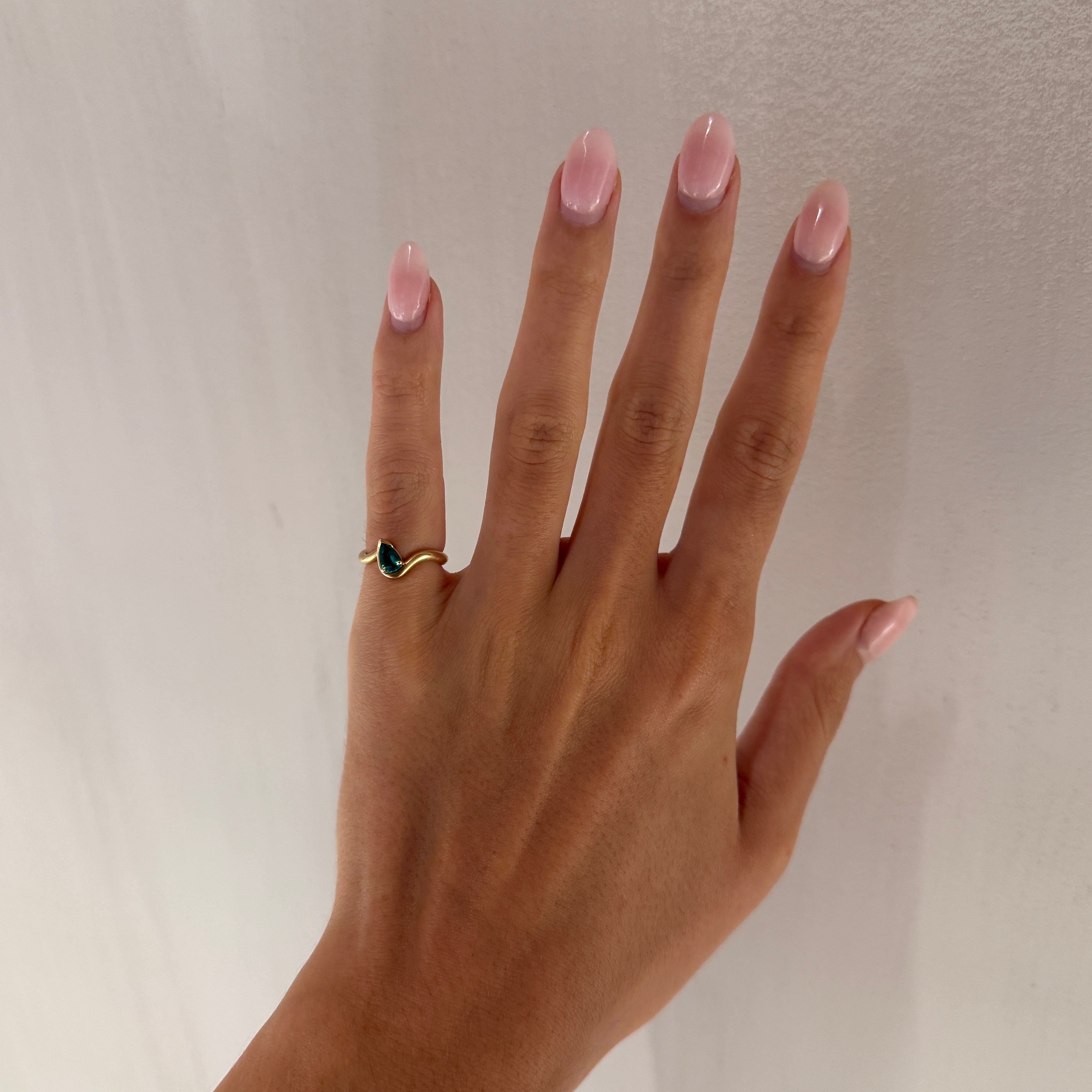BB Thelma Emerald pinky ring on hand, 14k yellow gold
