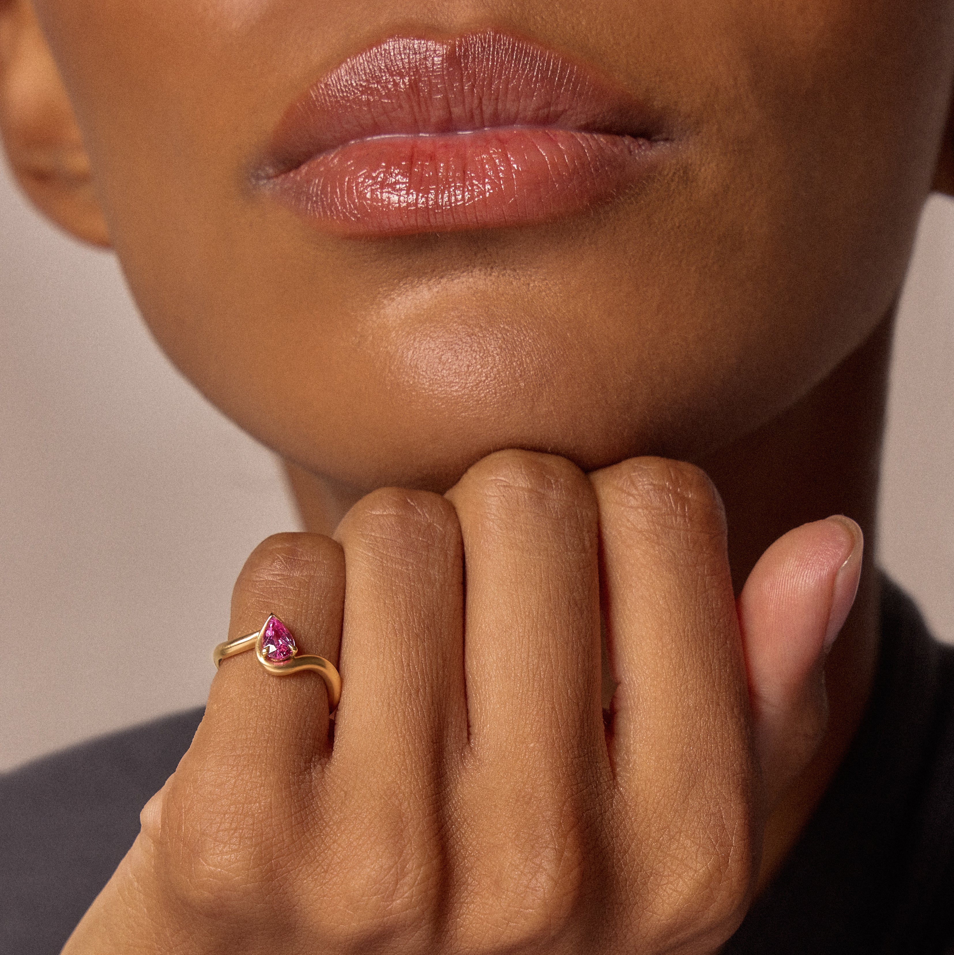 Hand model wearing BB Thelma Pink Sapphire pinky ring in 14k yellow gold 