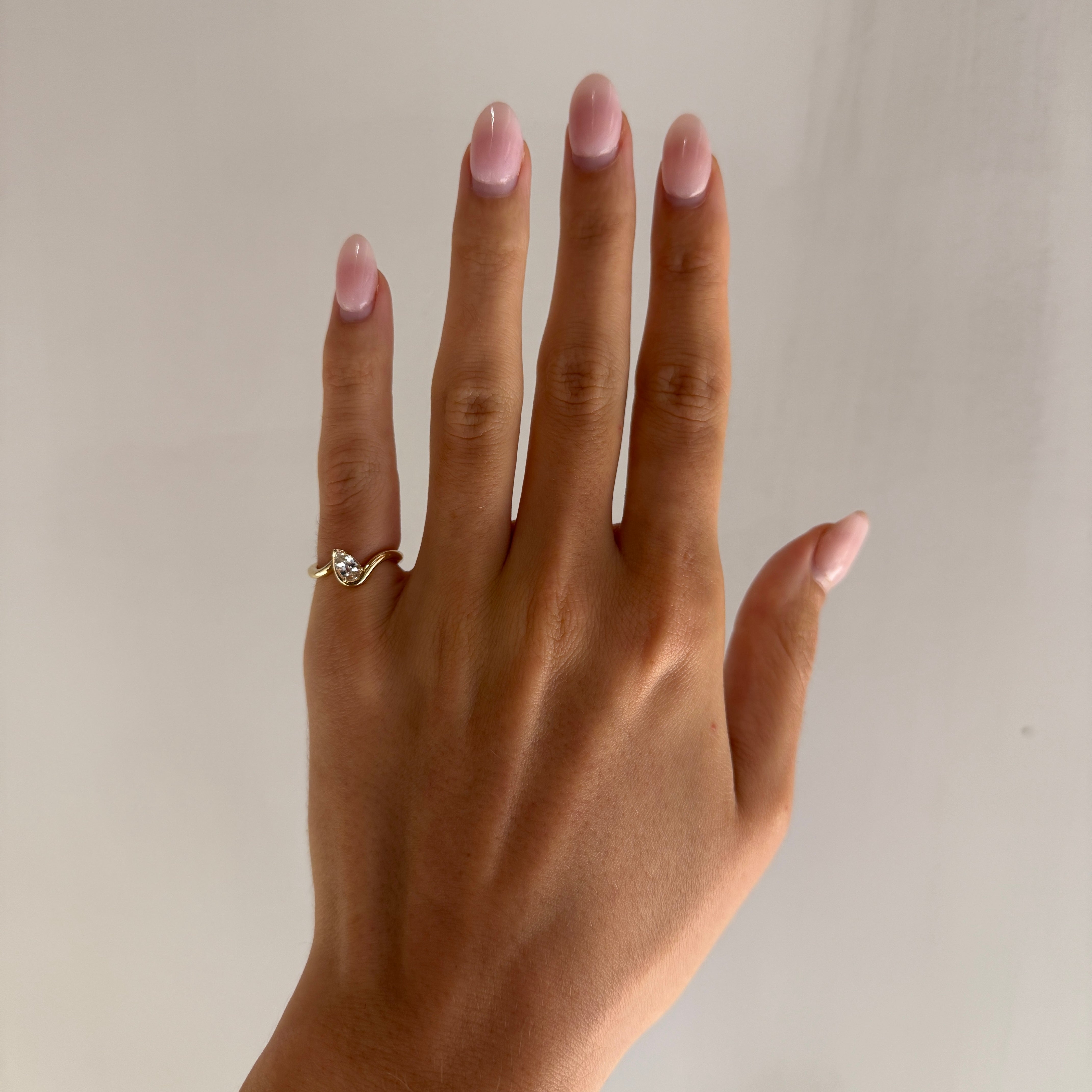 BB Thelma White Sapphire on hand, 14k yellow gold.