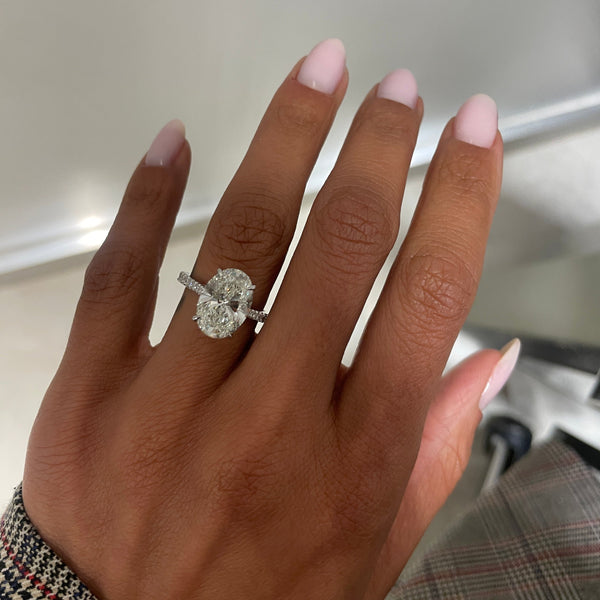 White Oval Diamond Set On A Pavé Band