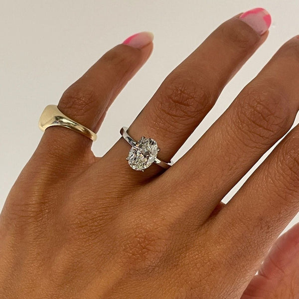 Oval Solitaire Set In Platinum on hand
