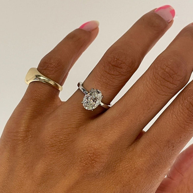 Oval Solitaire Set In Platinum on hand