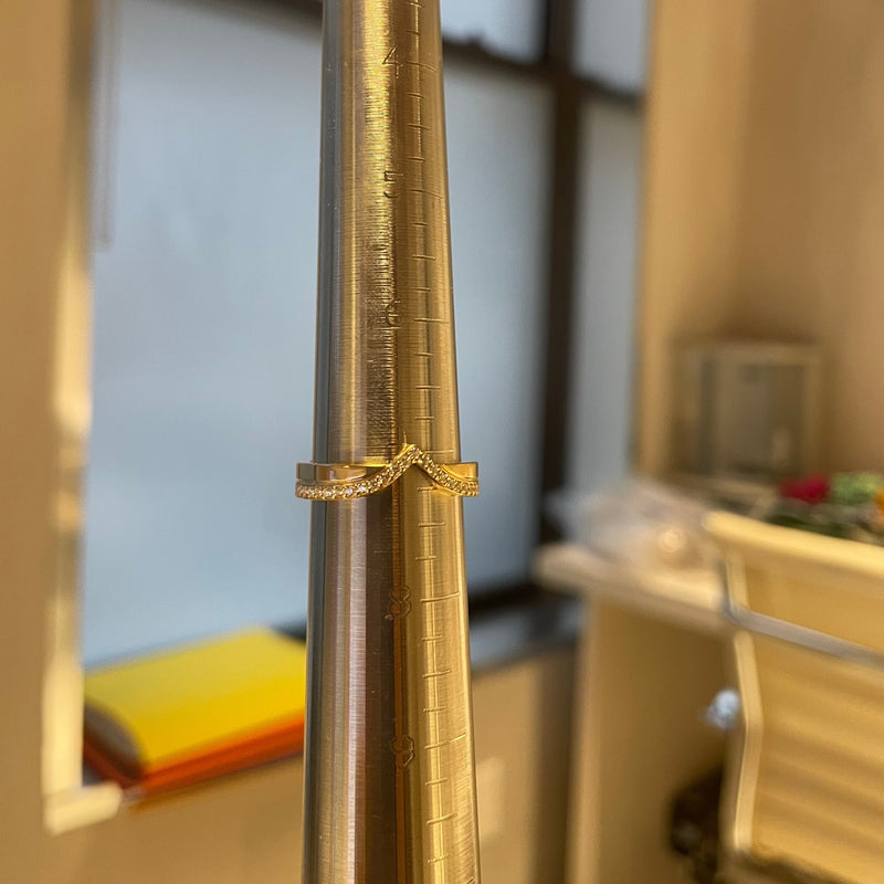 Petite V-shaped Cigar Wedding Band on mandrel