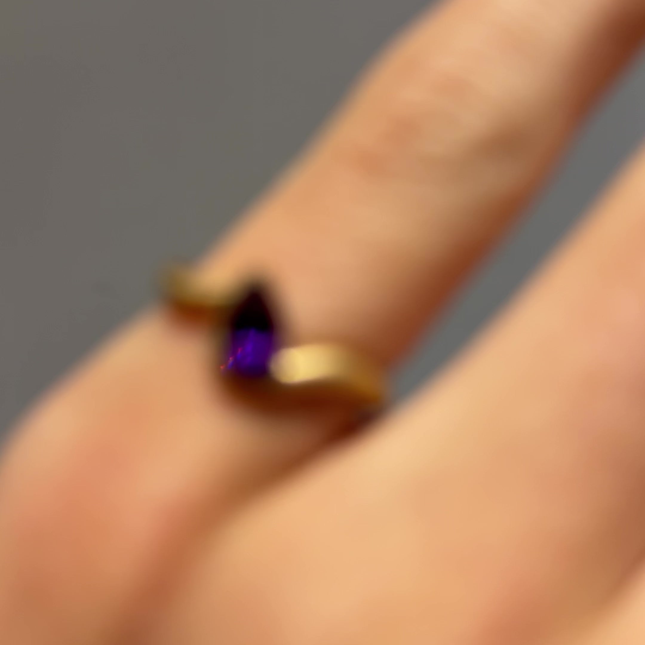 Hand model wearing BB Thelma Amethyst pinky ring in 14k yellow gold